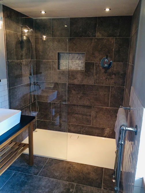 walk in shower and pedestal sink